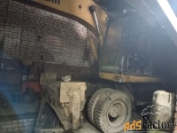 Экскафатор Caterpillar